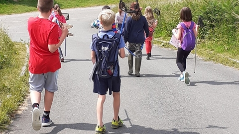 Children carrying pond dipping nets