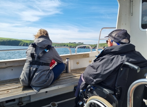 Two people on a boat. 