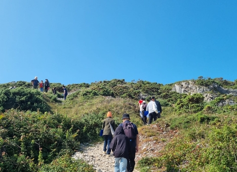 Chinese in Wales assosication members attending a walk at Port Eynon point on a sunny day 